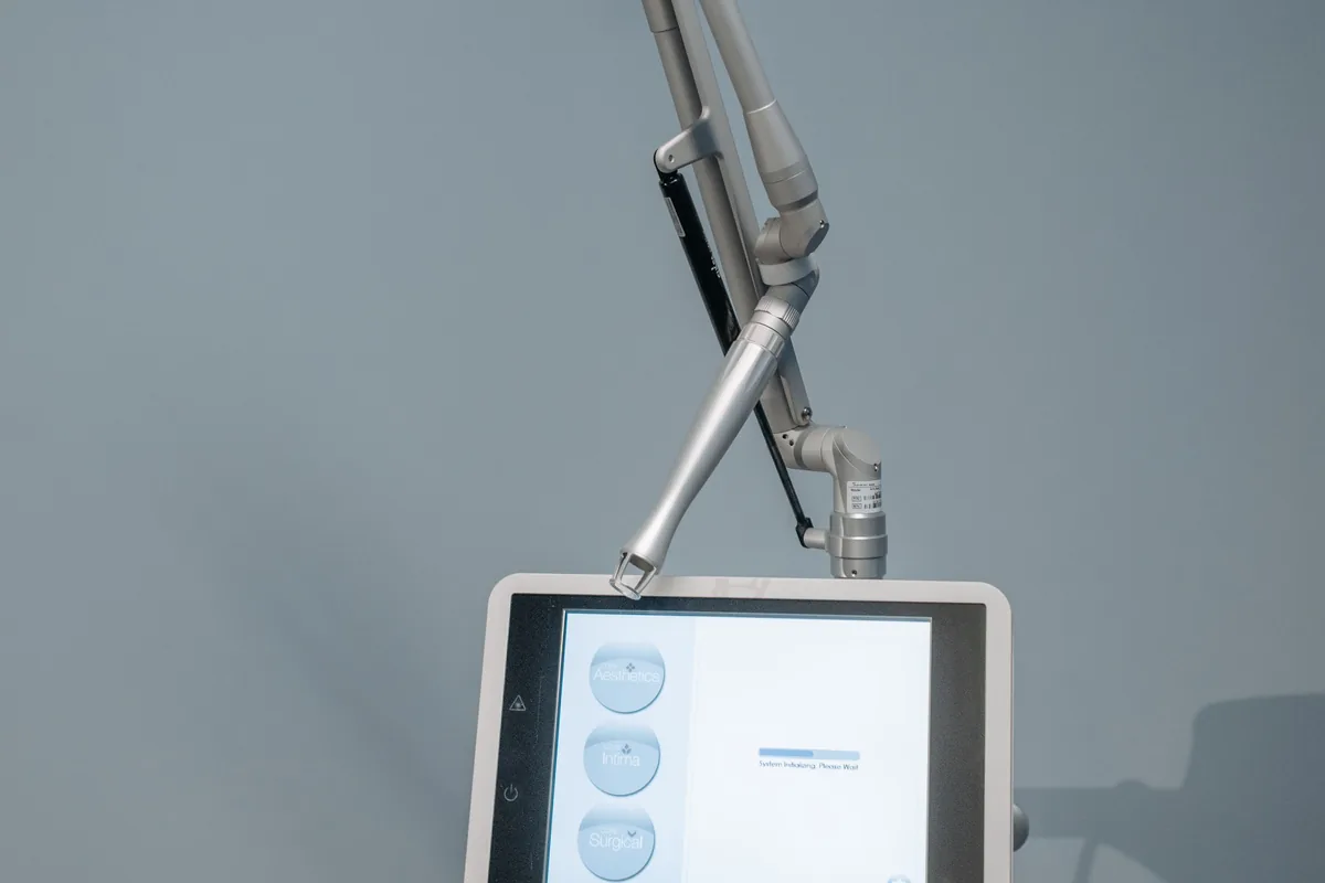Aesthetic laser machine in a clinic treatment room, similar to those used for tattoo removal in Penang