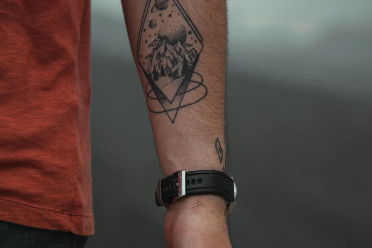 Small geometric tattoo on an inner forearm, a moderate spot on the tattoo pain chart