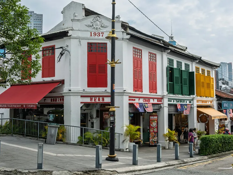 Colourful heritage shophouses with shuttered windows