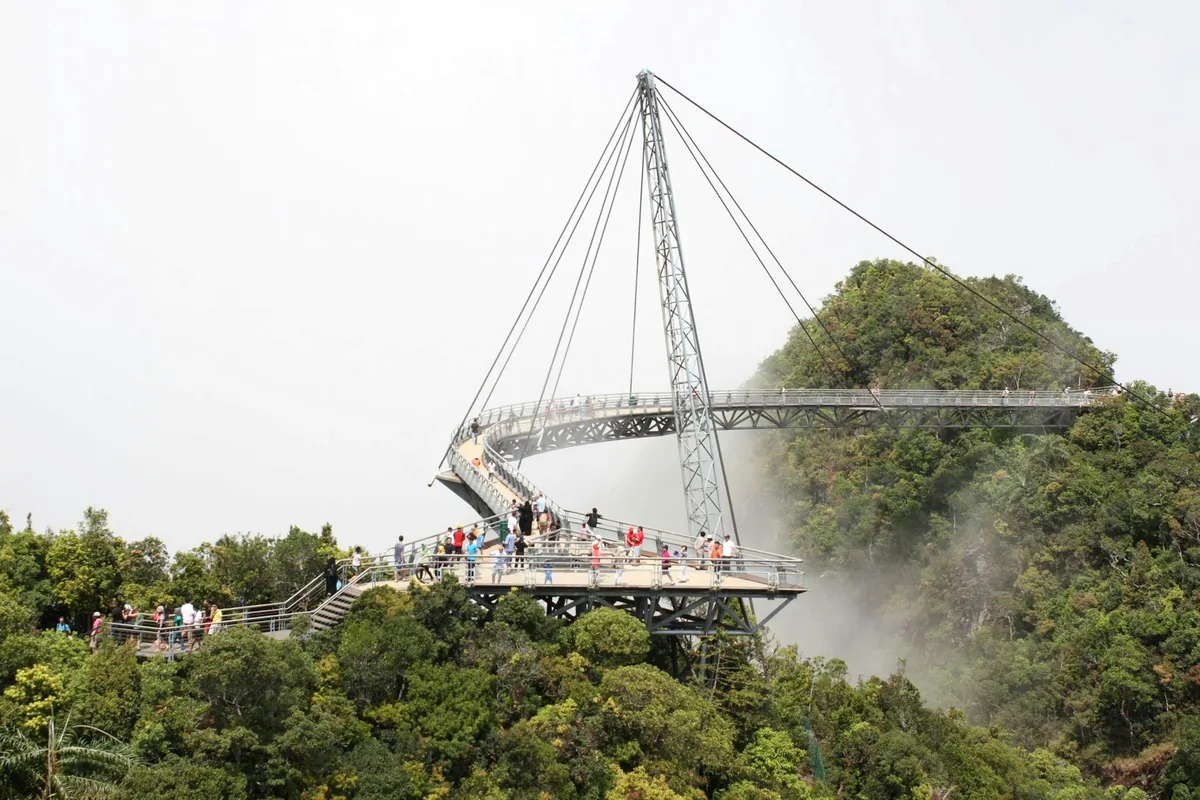 Langkawi Sky Bridge curving over the rainforest, a popular stop before a tattoo in Langkawi